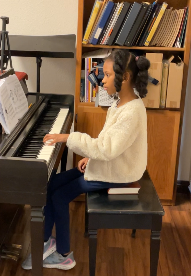 Student practicing piano during a Keys to Confidence lesson